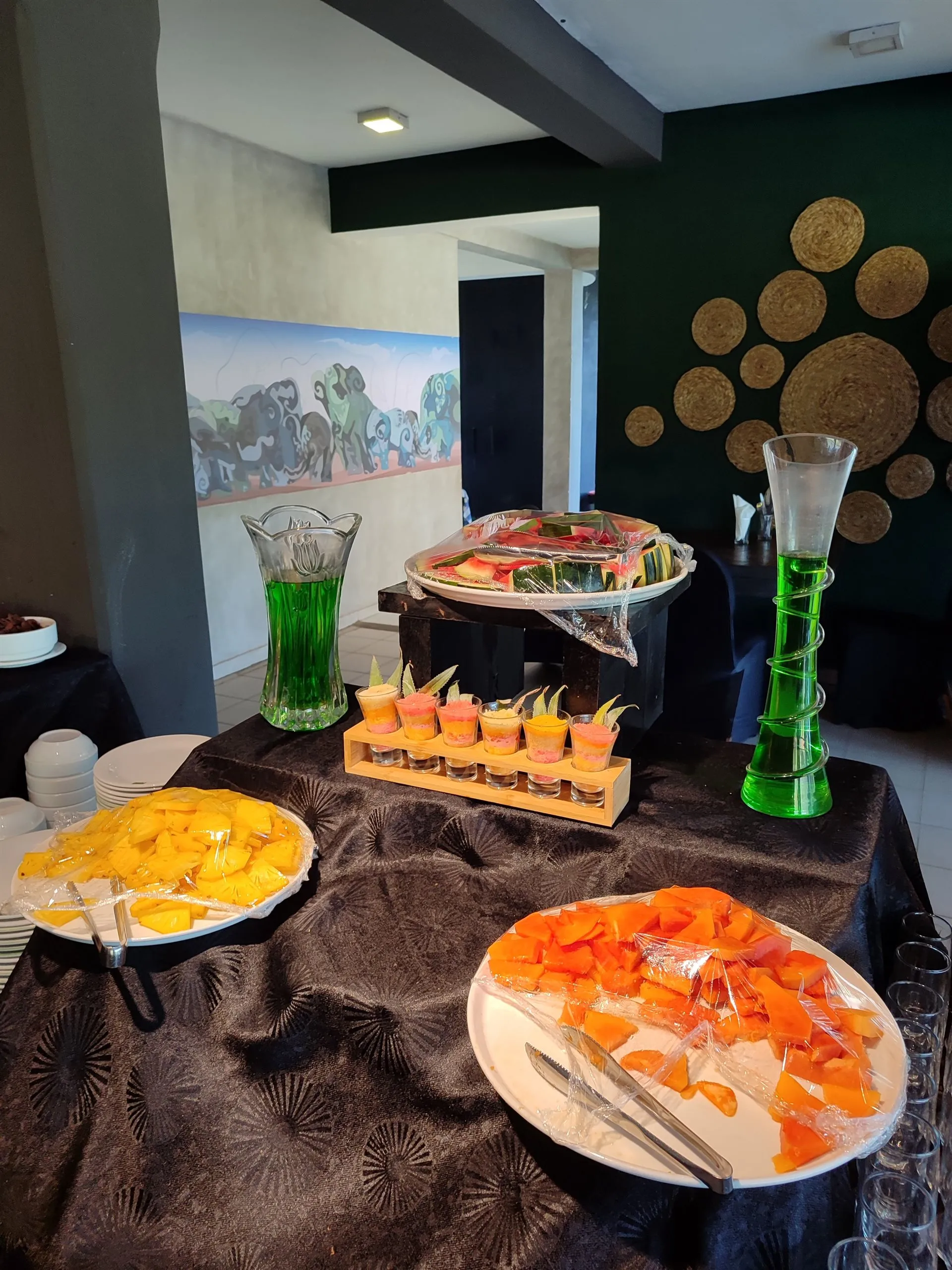 Papaya, pineapple and banana laid out for breakfast