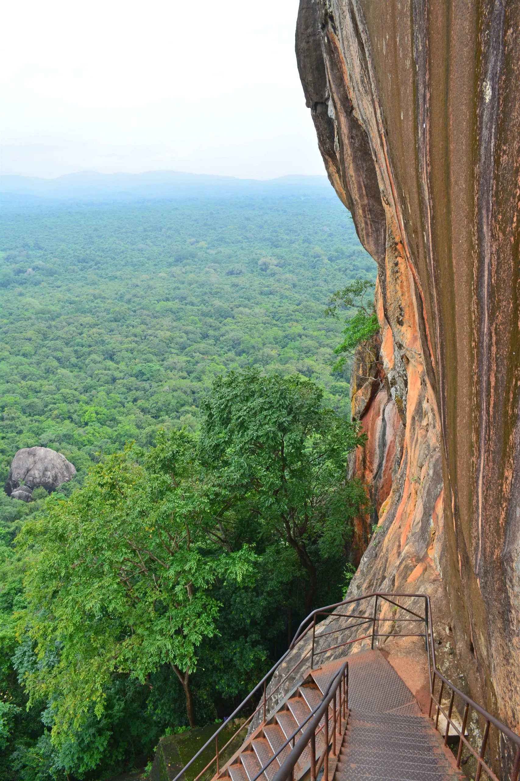 The metal stairway bolted to the cliff face on the climb up Sigiriya