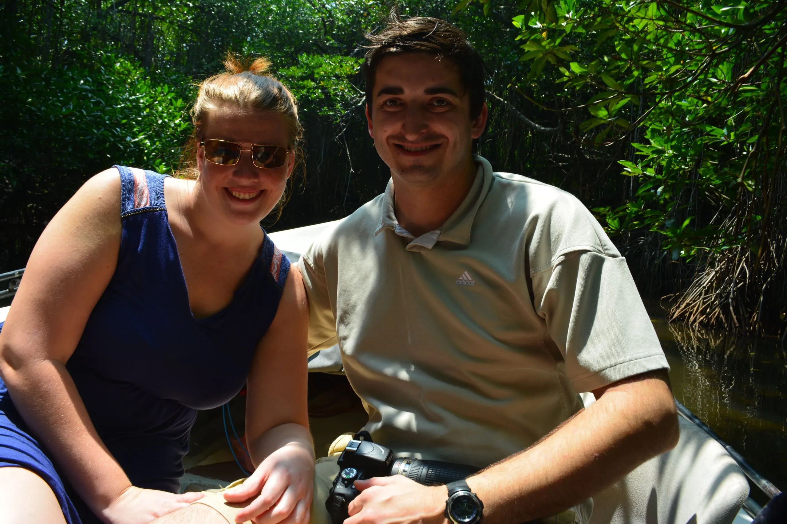 The couple in a small boat under the mangroves on the Bentota river